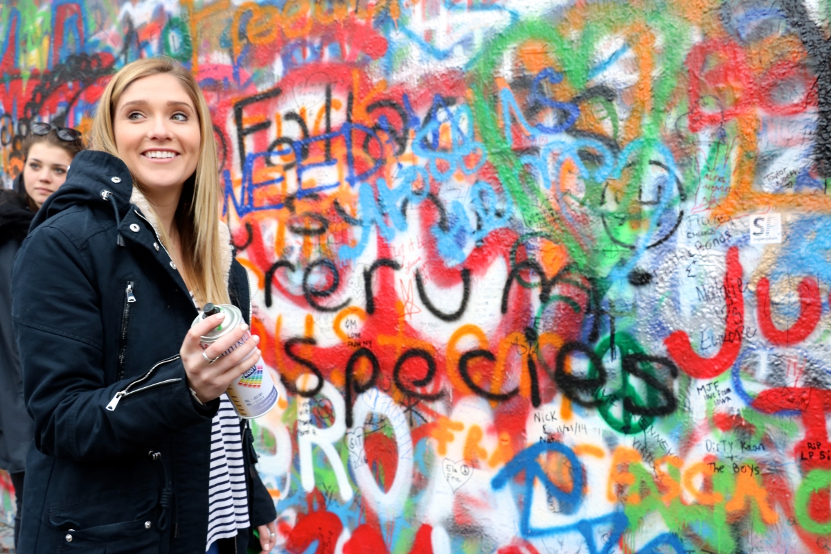 Niki tagging the John Lennon Wall  